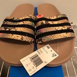 Adidas slip ons, new with tags and box.
